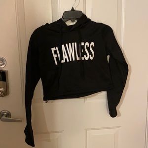 Black crop top. “Flawless”